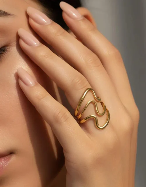 The Fluid Gold Wave Ring