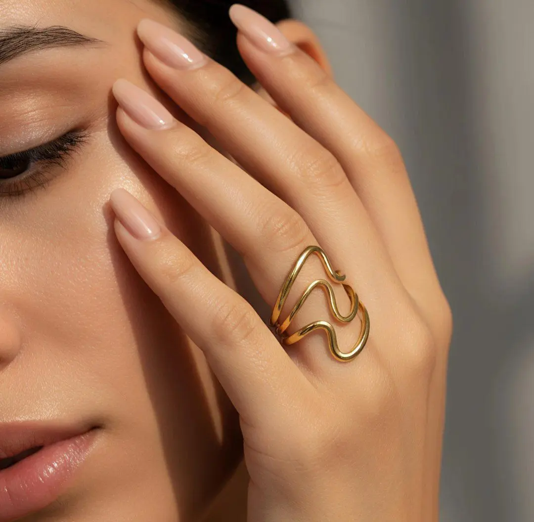 The Fluid Gold Wave Ring